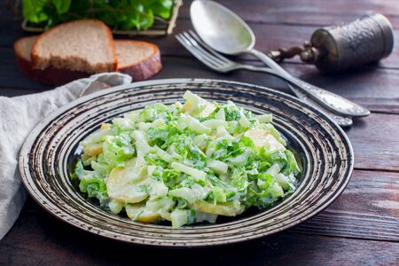 Salad with boiled potatoes and fresh celery and greens, horizontalの写真素材