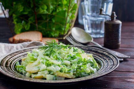 Salad with boiled potatoes and fresh celery and greens, horizontalの写真素材