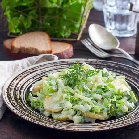 Fresh homemade potato salad with greens, squareの写真素材