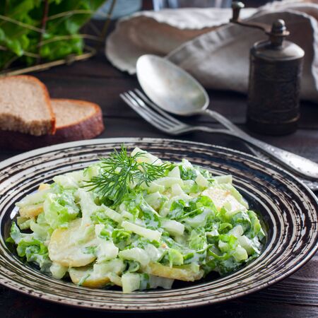 Fresh homemade potato salad with greens, squareの写真素材
