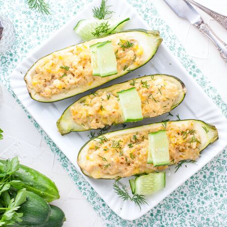 Baked zucchini with rice filling in the form of boats, squareの写真素材