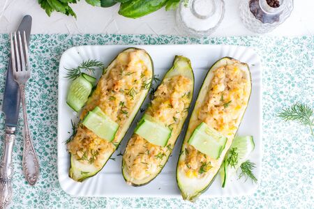 Zucchini stuffed with rice and chicken, decorated with fresh cucumber. Festive menu, horizontalの写真素材