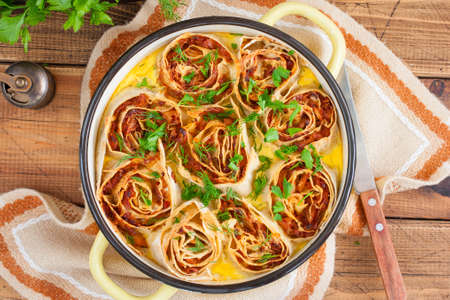 Cabbage pie in a round pan, selective focusの写真素材
