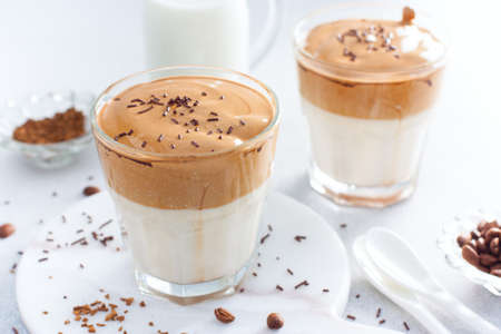 Cold drink with coffee, milk, sugar and water, dalgona coffee, horizontalの写真素材