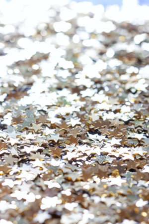 macro confetti golden stars, backgroundの写真素材