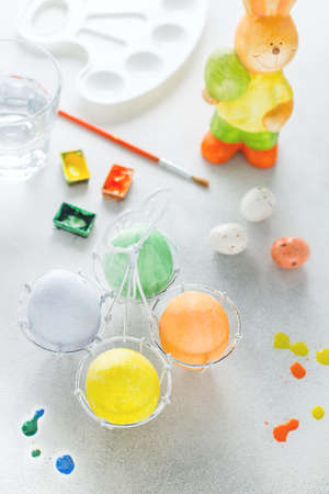 Colorful eggs for easter painted by children with paints, selective focusの写真素材