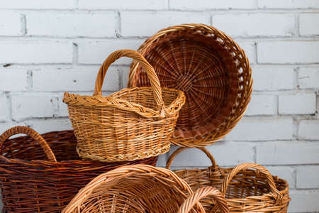 Handmade willow wicker baskets with two handles, one handle, no handles on the table, horizontalの写真素材