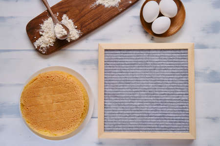 Flour and eggs for baking biscuit, white background and copy space for textの写真素材