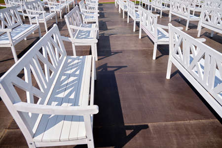 White wooden outdoor benches for spectators.の写真素材