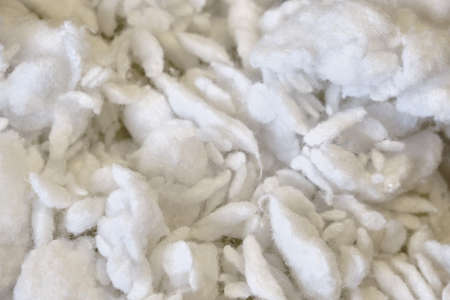 Background stuffing wadded cotton wool. Texture of the stuffing of the pillow as cotton.の写真素材