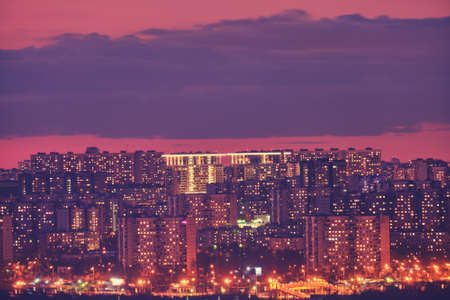 Houses with luminous windows in a residential area of the city.の写真素材