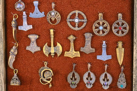Collection of ancient signs and amulets. Axes, knives, Phoenix snakes and other symbols in the form of a badge.の写真素材