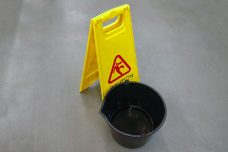 A bucket of water and sign background.