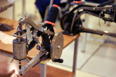 Tool for repairing and flashing shoes. Old sewing machine for working with leather
