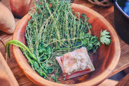 With a piece of bacon in the bowl with the herb and seasoning. The food of the first American settlers in the wild West and gold miners.の写真素材