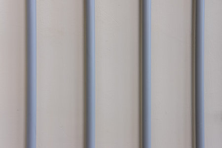 Lines of electric wires laid in a plastic casing on the wall