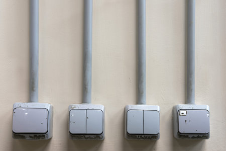 Electrical switches light on a dirty wall. Old wiring network