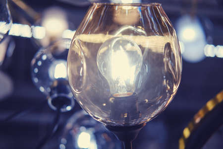 Large lamp in a glass shade, bulb close-upの写真素材
