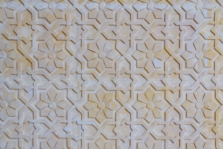 Yellow floral background. Texture with flower patterns on the rock surface. Texture arabic pattern...
