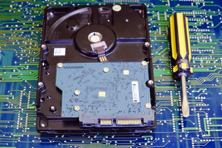Hard drive with a screwdriver for repair or installation