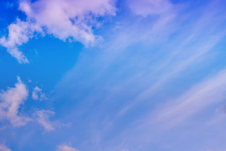 Cumulus clouds on the background of the evening sky, a copy space for inscriptions