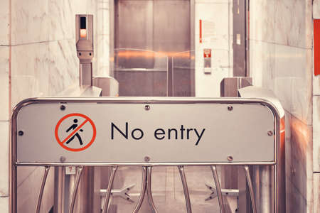 Inscription No entry and passage to the corridor closed by a turnstileの写真素材