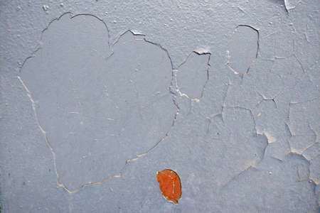 Gray peeling paint in several layers on the metal, rusty background, copy spaceの写真素材