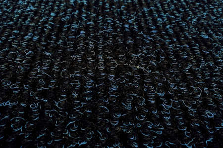 Texture of black rug with blue villi, background close-upの写真素材