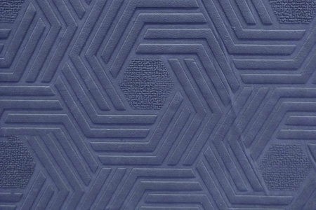 Surface texture with a pattern of dark blue rhombus geometric shapes, background
