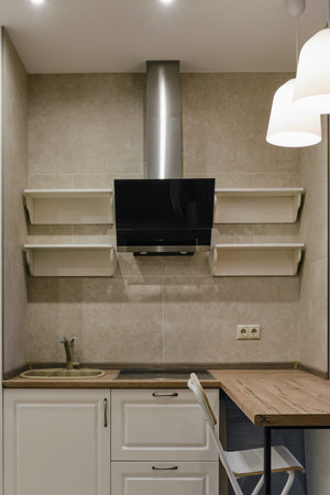 New modern kitchen with a bar counter in white and beige colors. Kitchen furniture in the style of French Provenceの写真素材