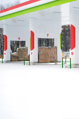 Abandoned modern gas station for cars with gasoline canned for the winter