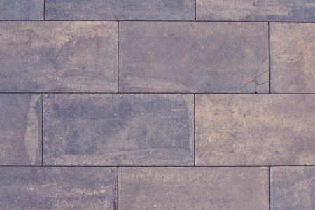 Texture of rectangular tiles of gray color, old background