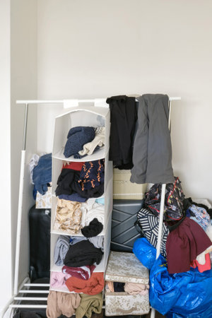 Clutter of things and clothes without a wardrobe