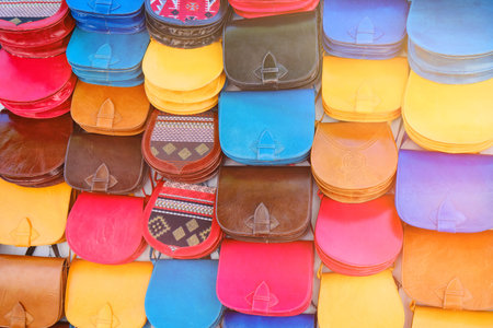 Arab leather bags hanging on the wall in gift shop, Sidi Bou Said, Tunisia