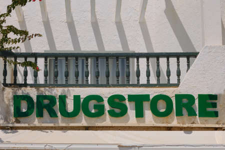The inscription on the sign drugstore store - the text on the facade of a pharmacy in Tunisiaの写真素材