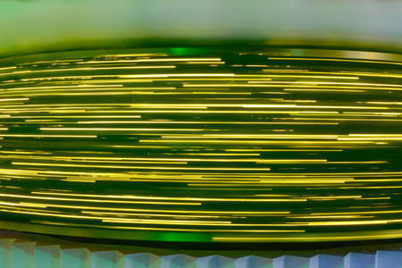 Christmas lights blurred motion background, golden bokeh of urban street lampsの写真素材