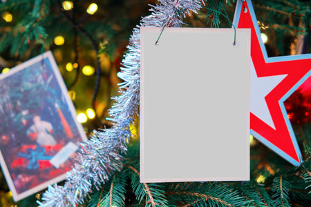 Christmas tree with star decorations and a postcard. Vintage background with copy space, new year...