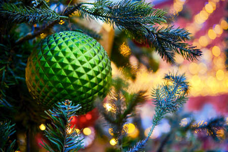 Big green ball on a branch christmas tree, copy spaceの写真素材