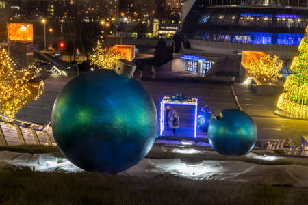 Large Christmas balls on the ground as an element of decoration of city streets for the new yearの写真素材