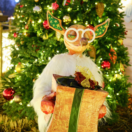 Figurine fox with a gift of near the Christmas tree, decoration for the new year. Christmas composition in Moscow on Manezhnaya square - Moscow, Russia, December, 24, 2019のeditorial素材