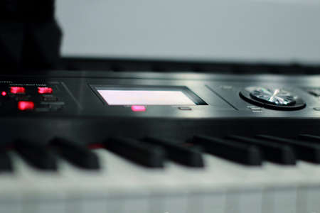 The synthesizer is in the recording Studio. Included electronic piano with burning scoreboard. Large white and black keysの写真素材