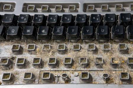 Dirty disassembled the keyboard is prepared for cleaning. Do-it-yourself computer keyboard disassemblyの写真素材