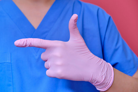 Concept of stay at home. The medic finger shows the direction to go back home. Doctor in protective...