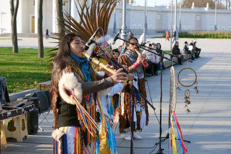American Indians street musicians in national costumes play in a city Park - Moscow, Russia, 10 25...