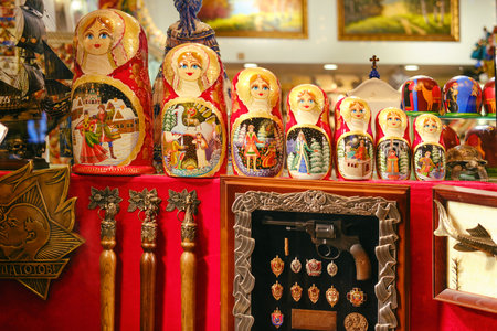 Soviet souvenir shop - showcase with Lenin, Russian nesting dolls, badges and a revolver - Moscow, Russia, 12.12.2019のeditorial素材