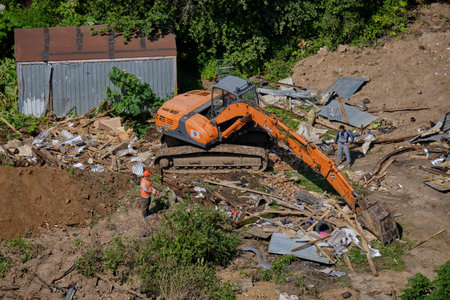 Construction machinery destroys illegal buildings in the forest - Moscow, Russia, June 26, 2020のeditorial素材