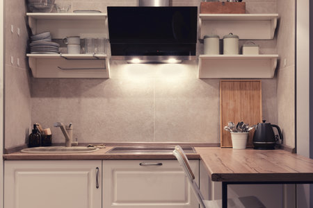 Modern kitchen with dishes, appliances and items in the retro style of French Provence. Clean furniture, plates and cups on vintage kitchen shelvesの写真素材