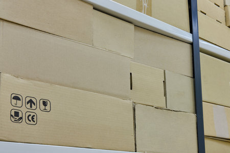 Cardboard boxes at the post office close-up, quarantined due to coronavirusの写真素材