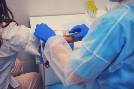 Doctor giving an injection to a woman for a test for antibodies to coronavirus, lifestyle. Woman waiting for an injection of a vaccine against flu virusの写真素材