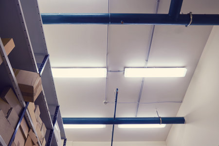Ceiling with fire extinguishing system in the technical room of the warehouse